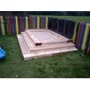 raised wooden sandpit